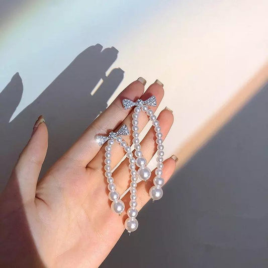 KOREAN PEARLY BOW FANTASY EARRINGS