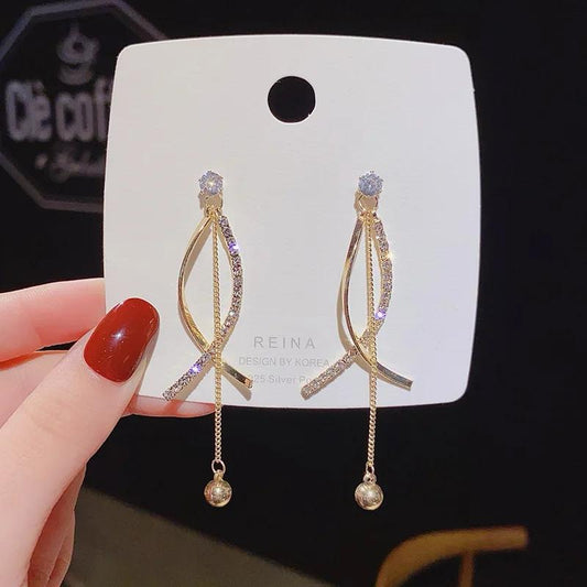 Criss cross tassel drop earrings