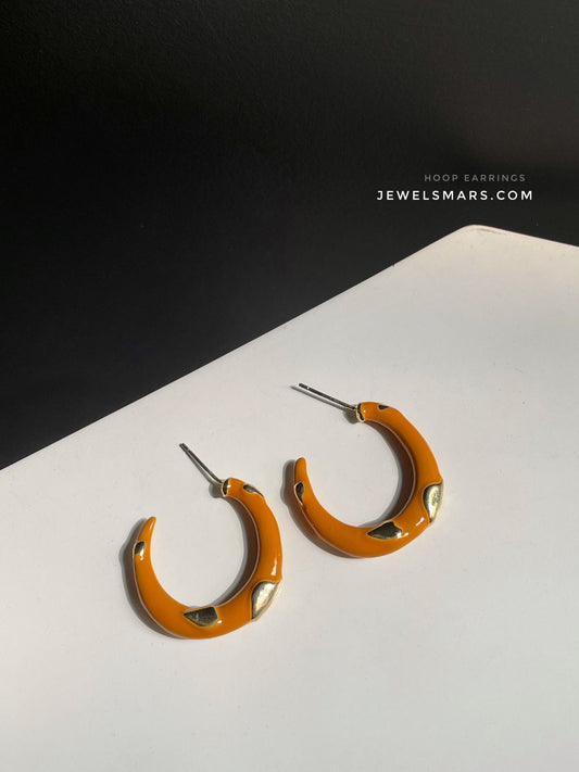 C shaped hoops in oil colour with golden details